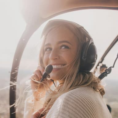 photo of a pilot smiling in the cockpit